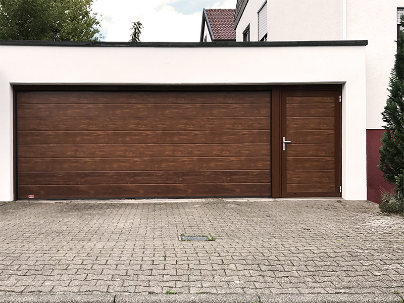 Sectional garage door woodline with side door